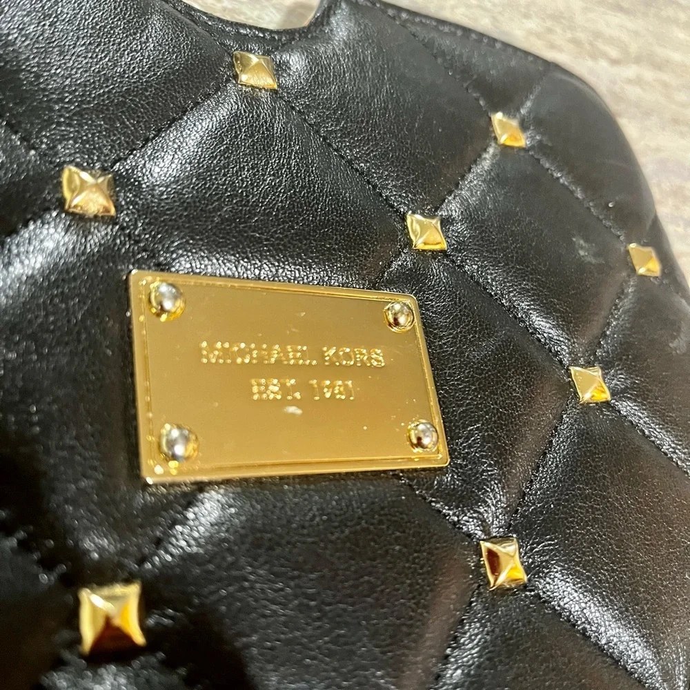 Michael Kors quilted tablet cover with gold color studs